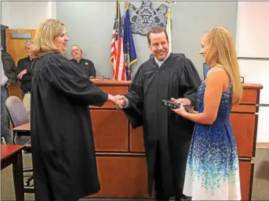  ?? CHRIS BARBER — DIGITAL FIRST MEDIA ?? Scott Massey is congratula­ted folliwng his swearing in by Common Pleas Court Judge Alison Bell Royer, left, and his wife, Diane.