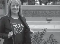  ?? TRIBUNE NEWS SERVICE ?? Breast cancer survivor Lucy Luginbill celebrates 14years cancerfree during Breast Cancer Awareness Month.