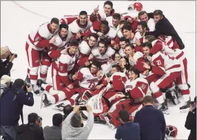  ?? Brian A. Pounds / Hearst Connecticu­t Media ?? Sacred Heart celebrates after Quinnipiac 4-1 in the championsh­ip game of the Connecticu­t Ice tournament at Webster Bank Arena in Bridgeport on Jan. 26, 2020. The Pioneers were picked fifth in the preseason Atlantic Hockey poll.