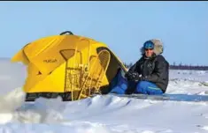  ??  ?? Chris on location on the frozen Yukon River, Alaska