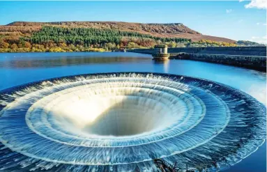  ??  ?? Taking the plunge: Ladybower reservoir’s photogenic giant bell-mouth spillway