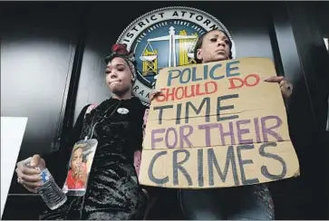  ?? Photograph­s by Rich Pedroncell­i Associated Press ?? SUPPORTERS OF Stephon Clark, an unarmed black man killed by police, protest in April. Changes to Assembly Bill 931 no longer make it easier for prosecutor­s to criminally charge officers who use deadly force.