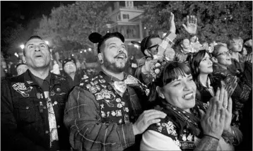  ?? PATRICK T. FALLON/PHOTOS FOR THE TIMES ?? Disney fans have formed social clubs, groups of friends and family who wear denim vests and meet up at the parks.