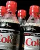  ?? JUSTIN SULLIVAN/GETTY ?? President Donald Trump’s diet reportedly features fast food and Diet Coke.