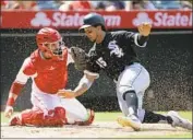  ?? Alex Gallardo Associated Press ?? ANGELS CATCHER Anthony Bemboom tags out White Sox runner Jon Jay in the sixth inning Sunday.