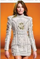  ?? ?? STYLISH: Carla Bruni on the Paris catwalk in a mini last week