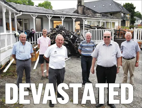  ?? Photo by Michelle Cooper Galvin ?? Bertie McSwiney, Dermot Hourigan, Sean Daly, John Sullivan Morgan, Jim Brosnan and Martin O’Brien at the remains of Kenmare Golf Club clubhouse after the devastatin­g fire in the early hours of Monday morning.