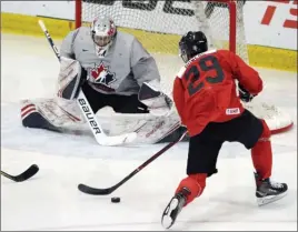  ?? The Canadian Press ?? Team Canada forward Shane Bowers tries to score on goaltender Michael DiPietro, who was backstoppi­ng the U Sports All-Stars on Friday but secured his roster spot for Canada’s national junior team. U Sports defeated Canada 5-1 on Friday after also winning 5-3 on Thursday. Canada won the opener of that three-game set, 3-2 in a shootout on Wednesday, as part of their selection camp in Colwood, B.C.