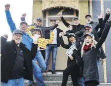  ??  ?? The Dolce Vita Homes crew, along with Mike Holmes Jr., back left, celebrate the opening of the Net Zero home.