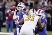  ?? AP photo ?? Bills quarterbac­k Josh Allen passes under pressure from Saints defensive tackle Josiah Bronson in the first half Thursday.