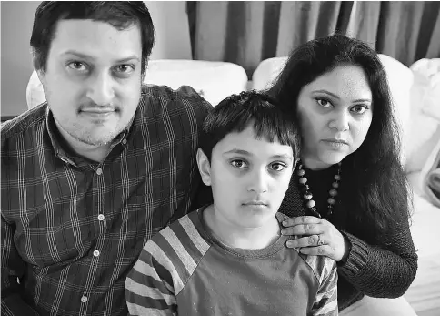  ??  ?? Sengupta (right) sits with her husband Sadhak and son Josh at their home in Sharon on Apr 5.