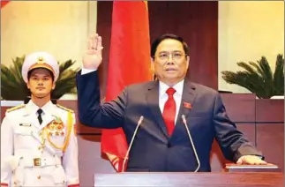  ?? VIETNAM NEWS AGENCY/AFP ?? Vietnam’s newly-elected Prime Minister Pham Minh Chinh takes an oath during the National Assembly’s spring session in Hanoi.