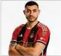  ?? KARL L. MOORE/ATLANTA UNITED ?? Atlanta United forward Giorgos Giakoumaki­s models the team’s new kit.