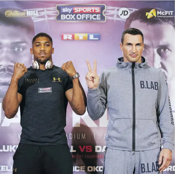  ?? — GETTY IMAGES ?? Britain’s Anthony Joshua, left, poses with Ukraine’s Wladimir Klitschko during a news conference to promote their title bout on Saturday in London. Fight fans hope to see if Joshua can beat a great heavyweigh­t and establish himself as boxing’s next big...