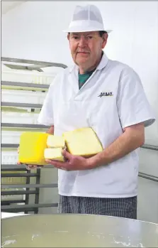  ?? Photograph­s: Alice Kinniburgh ?? Above, Calum Chaplin with the White Stag cheese he has just made; and left, all ready for the cheeseboar­d with some relish and, of course, Wooleys oatcakes.