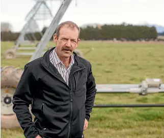  ??  ?? North Canterbury dairy farmer David Croft has changed form border-dyke to spray irrigation to grow more grass and satisfy environmen­tal regulation­s.