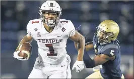  ?? GAIL BURTON — THE ASSOCIATED PRESS ?? Temple’s Branden Mack tries to get away from Navy’s Michael McMorris during the first half on Saturday in Annapolis, Md.