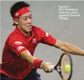  ??  ?? Japan’s Kei Nishikori returns a shot against Donald Young