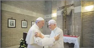  ?? POPE AND POPE EMERITUS Associated Press ?? Benedict, right, with his successor, Francis, in 2017. Once retired, Benedict kept a low profile.