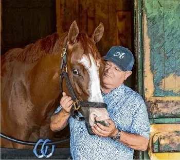  ?? Skip Dickstein/special to the Times Union ?? Trainer Danny Gargan has a quiet moment with Schuylervi­lle Stakes entrant Complexion on the day before the opening of the 2024 season at Saratoga.