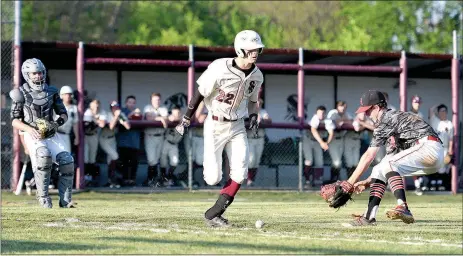  ?? Bud Sullins/Special to Siloam Sunday ?? Siloam Springs senior Chandler Cook runs to first base as Russellvil­le pitcher Joel Barker fields the ball in the seventh inning of Wednesday’s game. The Cyclones defeated the Panthers 4-1.