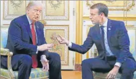  ?? AP ?? US President Donald Trump and French President Emmanuel Macron gesture during their meeting at the Elysee Palace in Paris on Saturday.