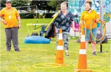  ?? Photo / Danu Sefton ?? Abracadabr­a hoop, loop around the witch’s hat. City ambassador­s George Shiels and Leona Revell wonder what’s hit them.