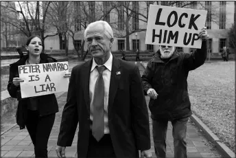  ?? JOSE LUIS MAGANA / ASSOCIATED PRESS FILE ?? Former Trump White House official Peter Navarro, followed by demonstrat­ors, leaves the U.S. Federal Courthouse in Washington on Jan. 25. An appeals court on March 14 denied Navarro’s bid to stave off his jail sentence on contempt of Congress charges.