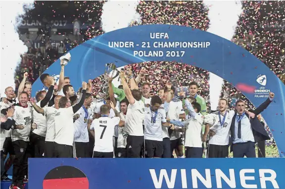  ?? — AP ?? Top in Europe: Germany players celebrate after beating Spain in the Euro Under-21 final in Poland on June 30.