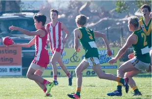  ??  ?? Trafalgar’s Blake Zimora kicks into attack during the under 16 match against Hill End; Photograph­s: Paul Cohen.