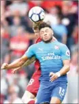  ?? AFP ?? Alex Oxlade-Chamberlai­n goes up for a header during Arsenal’s English Premier League match with Liverpool on Sunday.