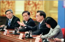  ?? KUANG LINHUA / CHINA DAILY ?? Premier Li Keqiang says China will ensure smooth implementa­tion of the Foreign Investment Law during a news conference at the Great Hall of the People on Friday.