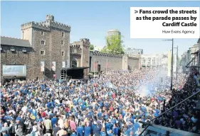  ?? Huw Evans Agency ?? &gt; Fans crowd the streets as the parade passes by Cardiff Castle