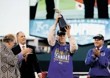  ?? Matt Slocum / Associated Press ?? Owner David Glass (center) put the Royals on the path toward the ALCS win in 2006, when he hired a new general manager.