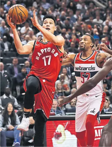  ?? RICHARD LAUTENS TORONTO STAR ?? The Raptors wasted no time finding playing time for Jeremy Lin, going in for a layup, against the Wizards on Wednesday — hours after signing him. He finished with eight points on 3-for-7 shooting, five rebounds, five assists, a steal and a block.