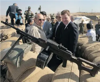  ?? RYAN REMIORZ/THE CANADIAN PRESS ?? John Baird, seen in Iraq last September, confirmed Tuesday that he is resigning as foreign affairs minister and will not seek re-election.