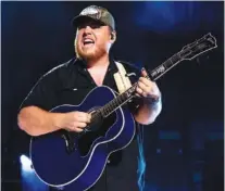  ?? PHOTO BY AMY HARRIS/INVISION/AP ?? Luke Combs performs during CMA Fest 2022 in June in Nashville. Comb’s latest album, “Growin’ Up,” released Friday.