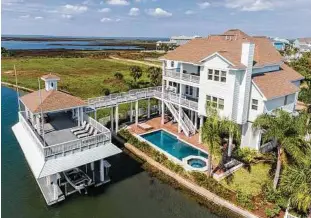  ??  ?? This large, high-end home is in Galveston’s Pirates Cove.