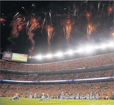  ?? Justin Edmonds Getty Images ?? THE CHARGERS kicked off the season against the Broncos at Sports Authority Field at Mile High on Sept. 11. The Chargers are not expecting to have the same level of noise for their home opener at StubHub Center.