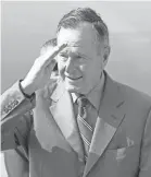  ??  ?? Former President George H.W. Bush salutes during a visit to a military airbase in Bangkok, Thailand, in 2006.