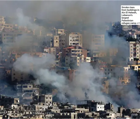  ?? AFP ?? Smoke rises from buildings in Ain El Helweh, Lebanon’s largest Palestinia­n refugee camp