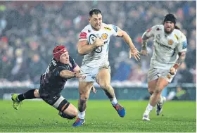  ??  ?? Going solo: Exeter’s Sam Hill surges past Ben Morgan of Gloucester at Kingsholm