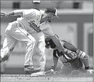  ?? AP/The Advocate/HILARY SCHEINUK ?? Arizona State’s Spencer Torkelson slips past the tag of Stony Brook second baseman Brandon Janofsky on an RBI double in an NCAA regional game Saturday in Baton Rouge. The Sun Devils won 13-5.