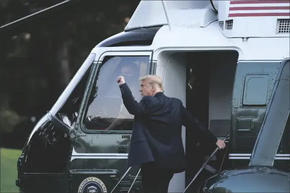  ?? ASSOCIATED PRESS ?? PRESIDENT DONALD TRUMP BOARDS MARINE ONE at the White House in Washington on Tuesday for a short trip to Andrews Air Force Base, Md., and then on to Erie, Pa. for a campaign rally.
