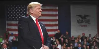  ??  ?? DES MOINES: President-Elect Donald Trump looks on in Des Moines, Iowa on Thursday during the USA Thank You Tour 2016 at the Hy-Vee Hall in the Iowa Events Center. — AFP