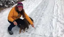  ?? COURTESY TASHA DIMARZIO ?? BEARING WITNESS: Anchorage, Alaska, resident Tasha DiMarzio points to a crack in the snow after an earthquake rattled the city yesterday.