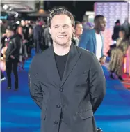  ?? ?? Top: Olly Murs performing at the Coronation Concert, and above, attending the ITV Palooza