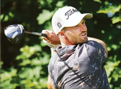  ?? Nathan Denette / Associated Press ?? Wyndham Clark hits his tee shot on the 14th hole during the second round of the Canadian Open at St. George’s Golf and Country Club in Toronto on Friday.