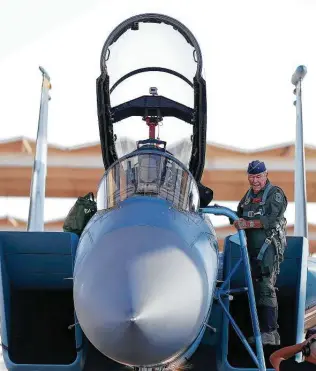  ?? Isaac Brekken / Associated Press file photo ?? In this photo from 2010, Yeager steps into an F-15D at Nellis AFB, Nev., for a re-enactment flight commemorat­ing his breaking of the sound barrier 65 years earlier.