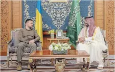  ?? SAUDI PRESS AGENCY
THE ASSOCIATED PRESS ?? Ukrainian President Volodymyr Zelenskyy meets with Saudi Crown Prince Mohammed bin Salman during the Arab summit in Jeddah, Saudi Arabia, on Friday. The Saudi crown prince expressed support for “whatever helps in reducing the crisis between Russia and Ukraine.”
